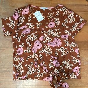A size S Madewell shirt that ties on the bottom. The tag is still on for $39.97.